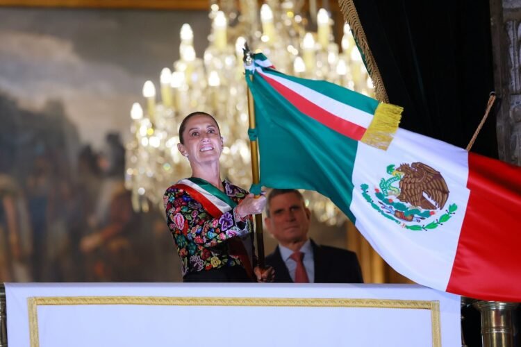 MEXICO CITY, MEXICO - SEPTEMBER 15: President of Mexico Claudia Sheinbaum waves the Mexican flag during the annual shout of independence (Grito de Independencia) as part of Mexico's Independence Day celebration at Zocalo on September 15, 2026 in Mexico City, Mexico. The event also known as 'El Grito de Dolores' (The Cry of Dolores) took place on the early morning of September 16, 1810 in Dolores, Guanajuato when catholic priest Miguel Hidalgo called to arms people in the town. Every year, Mexicans remember